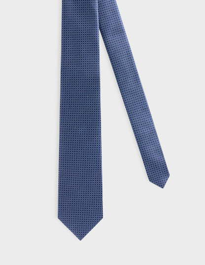 Cravate fine en soie bleue à motifs